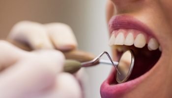 1786588265_dentist-examining-female-patient-with-tools-1024x683.jpg